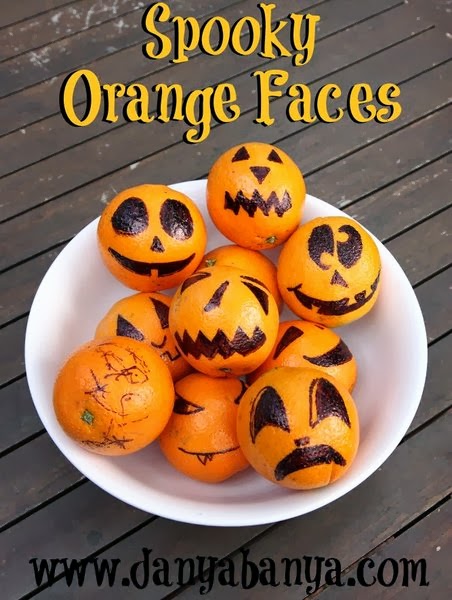 Spooky Orange Faces - healthy fruit snack for Halloween