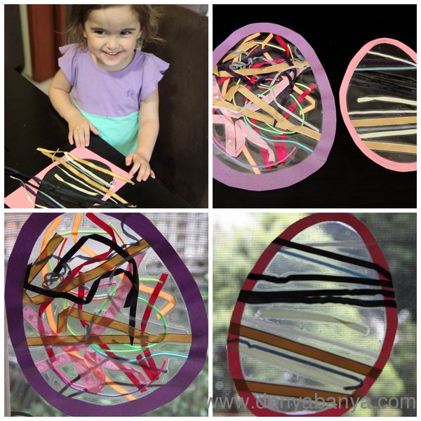 Toddler making Stained Glass Easter Egg with ribbons