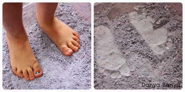 Footprints in foam dough. Counting toes.