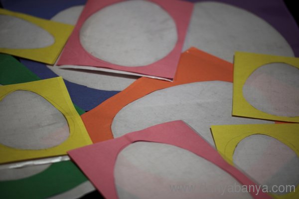 Cut outs of Easter eggs with contact paper