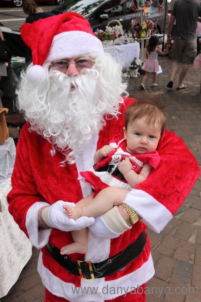 Santa holding baby Bee in her Mrs Claus outfit